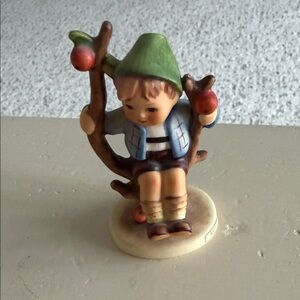 Charming Figurine with Green Hat